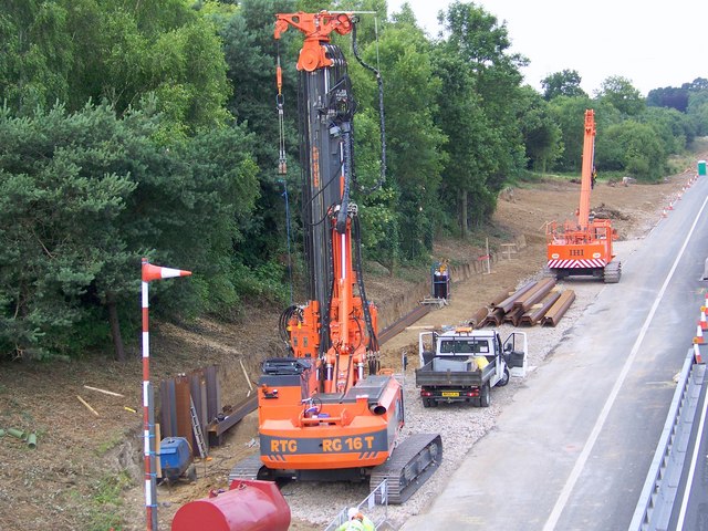 Piling rig and plant working on a roadside infrastructure scheme